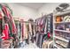 Walk-in closet with ample hanging space, shelving, and organized storage solutions at 326 Beethoven Ridge Dr, Henderson, NV 89011
