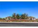 Community entrance featuring landscaping, signage, and architectural details at 326 Beethoven Ridge Dr, Henderson, NV 89011