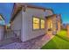 Charming home featuring a covered patio, well-maintained landscape, and paved walkway at 326 Beethoven Ridge Dr, Henderson, NV 89011