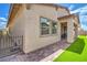 Home featuring an outdoor patio with artificial grass, brick pavers, and secure fencing at 326 Beethoven Ridge Dr, Henderson, NV 89011