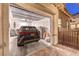 Attached garage showcasing car, storage items, and access to the home's exterior walkway at 326 Beethoven Ridge Dr, Henderson, NV 89011