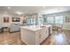 Open-concept kitchen and living room features a large island and modern design at 326 Beethoven Ridge Dr, Henderson, NV 89011