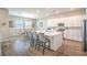 Bright kitchen with a large center island, modern appliances, and adjacent dining area at 326 Beethoven Ridge Dr, Henderson, NV 89011
