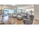 Open-concept living room with large sectional sofa and easy access to the kitchen at 326 Beethoven Ridge Dr, Henderson, NV 89011
