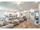 A spacious living area connects to the kitchen with a large comfortable sectional sofa at 326 Beethoven Ridge Dr, Henderson, NV 89011