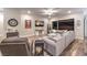 Comfortable living room features a large sectional and seamless indoor-outdoor flow at 326 Beethoven Ridge Dr, Henderson, NV 89011