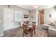 Bright living room featuring a ceiling fan, wood flooring, and a cozy seating area at 326 Beethoven Ridge Dr, Henderson, NV 89011