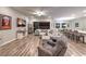 Open-concept living space with comfortable seating and connection to kitchen and dining at 326 Beethoven Ridge Dr, Henderson, NV 89011