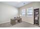 Home office with a desk, shelving, and natural light from the two windows at 326 Beethoven Ridge Dr, Henderson, NV 89011