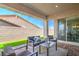 Inviting covered patio with comfortable seating, perfect for outdoor relaxation and entertaining at 326 Beethoven Ridge Dr, Henderson, NV 89011