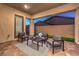 Relaxing covered patio features an outdoor seating area with stylish decor at 326 Beethoven Ridge Dr, Henderson, NV 89011