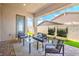 Covered patio featuring an outdoor seating area with modern furniture and decor at 326 Beethoven Ridge Dr, Henderson, NV 89011