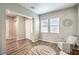 Sitting room with chairs, front door, wood floors, and natural light at 326 Beethoven Ridge Dr, Henderson, NV 89011