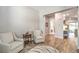 Sitting room with two armchairs, accent table, rug, and wood floors at 326 Beethoven Ridge Dr, Henderson, NV 89011