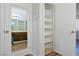 Bathroom mirror reflects sink and vanity, with shelving and closet space at 3811 Desert Marina Dr # 125, Laughlin, NV 89029