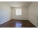 Bedroom with wood floors and a window covered with blinds at 3811 Desert Marina Dr # 125, Laughlin, NV 89029