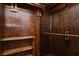 Spacious walk-in closet with wood paneling and custom shelving at 3811 Desert Marina Dr # 125, Laughlin, NV 89029