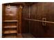 Walk-in closet with wood paneling and shelf and rod for storage at 3811 Desert Marina Dr # 125, Laughlin, NV 89029