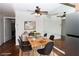 Charming dining room with wood table set on soft rug, ceiling fan, and decor at 3811 Desert Marina Dr # 125, Laughlin, NV 89029