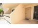 Condo entryway featuring a neutral-colored exterior, protected entry, and clean, well-maintained surroundings at 3811 Desert Marina Dr # 125, Laughlin, NV 89029