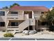 Charming condo featuring a red tile roof, a private balcony, and a quaint desert landscape at 3811 Desert Marina Dr # 125, Laughlin, NV 89029