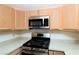 Bright kitchen features a modern stainless steel oven, stove top, and light wood cabinetry at 3811 Desert Marina Dr # 125, Laughlin, NV 89029