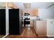 Well-lit kitchen with stainless steel appliances, wood-look flooring, and light wood cabinets at 3811 Desert Marina Dr # 125, Laughlin, NV 89029