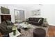 Staged living room with stylish furniture, decor, fireplace, and a sliding glass door at 3811 Desert Marina Dr # 125, Laughlin, NV 89029