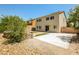 Spacious backyard with concrete patio, low-maintenance landscaping, and privacy fence, perfect for outdoor entertaining at 3820 Alpine Track Ave, North Las Vegas, NV 89032