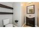 Powder room with dark wood accents at 3820 Alpine Track Ave, North Las Vegas, NV 89032