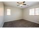 Bright bedroom with neutral paint, carpet, and large windows with blinds at 3820 Alpine Track Ave, North Las Vegas, NV 89032