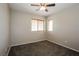 Standard bedroom featuring carpet, neutral paint, ceiling fan, and windows with blinds at 3820 Alpine Track Ave, North Las Vegas, NV 89032