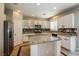 Modern kitchen with granite countertops, stainless steel appliances, and custom cabinets at 3820 Alpine Track Ave, North Las Vegas, NV 89032