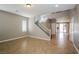 Open-concept living area with staircase and views to the kitchen at 3820 Alpine Track Ave, North Las Vegas, NV 89032