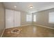 Bright living room with tile floors, large windows, and natural light at 3820 Alpine Track Ave, North Las Vegas, NV 89032