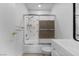 Cozy bathroom with shower-tub combo, floral patterned shower tiles, and a modern sink at 3923 Gogo Way # 106, Las Vegas, NV 89103