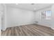 Bright bedroom features modern flooring, a window providing natural light, and neutral walls at 3923 Gogo Way # 106, Las Vegas, NV 89103