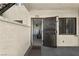 Front entrance with iron security gate, opening up to kitchen and dining area at 3923 Gogo Way # 106, Las Vegas, NV 89103