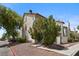 Exterior view of the home with desert landscaping and gated entryways at 3923 Gogo Way # 106, Las Vegas, NV 89103