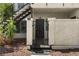 Front exterior with stairs leading to unit 105 and a privacy gate to unit 106 at 3923 Gogo Way # 106, Las Vegas, NV 89103