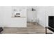 Open-concept living space with modern flooring and contemporary dining set at 3923 Gogo Way # 106, Las Vegas, NV 89103