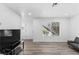 Bright living room featuring neutral tones, wood-look flooring, and natural light at 3923 Gogo Way # 106, Las Vegas, NV 89103