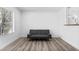 Bright living room featuring a comfortable sofa and modern flooring at 3923 Gogo Way # 106, Las Vegas, NV 89103