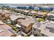 An aerial view of a neighborhood featuring two-story homes with tile roofs and well-maintained lawns at 4212 Juanita May Ave, North Las Vegas, NV 89032
