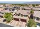 Rooftop view showcases a neighborhood with solar panels and tile roofs, plus stunning mountain views at 4212 Juanita May Ave, North Las Vegas, NV 89032