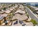 Aerial view of a neighborhood showing rooftops, solar panels, and street layouts at 4212 Juanita May Ave, North Las Vegas, NV 89032