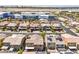 This aerial showcases an orderly community with two-story homes, each featuring tile roofs and attached garages at 4212 Juanita May Ave, North Las Vegas, NV 89032