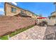 This backyard boasts a charming gazebo and brick patio, ideal for entertaining guests outdoors at 4212 Juanita May Ave, North Las Vegas, NV 89032