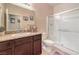 Bathroom features granite countertop, dark vanity and a glass-enclosed shower at 4212 Juanita May Ave, North Las Vegas, NV 89032