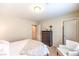 Well-lit bedroom with an attached closet and reading chair at 4212 Juanita May Ave, North Las Vegas, NV 89032